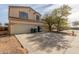 Two-story house with a double garage and spacious driveway at 2016 N Ensenada Ln, Casa Grande, AZ 85122