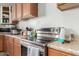 Stainless steel appliances and ample cabinetry highlight this kitchen at 2016 N Ensenada Ln, Casa Grande, AZ 85122