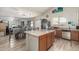 Kitchen with island, stainless steel appliances, and wood cabinets at 2016 N Ensenada Ln, Casa Grande, AZ 85122