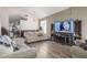 Living room with light beige couches and wood flooring at 2016 N Ensenada Ln, Casa Grande, AZ 85122