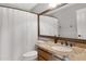 Bathroom boasts granite vanity and updated fixtures at 2023 E Glenhaven Dr, Phoenix, AZ 85048