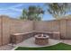 Cozy backyard fire pit with built-in seating at 2023 E Glenhaven Dr, Phoenix, AZ 85048