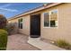 Dark brown metal front door with decorative accents at 2023 E Glenhaven Dr, Phoenix, AZ 85048