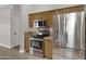 Stainless steel appliances and granite countertops highlight this kitchen at 2023 E Glenhaven Dr, Phoenix, AZ 85048