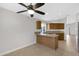 Kitchen features a breakfast bar and wood cabinets at 2023 E Glenhaven Dr, Phoenix, AZ 85048