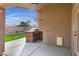 Covered patio with built-in BBQ and access to backyard at 2023 E Glenhaven Dr, Phoenix, AZ 85048