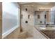 Large walk-in shower with built-in seat and tile surround at 2023 E Glenhaven Dr, Phoenix, AZ 85048