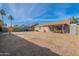 Large backyard with covered patio, shed and grassy area at 2057 E Brooks St, Gilbert, AZ 85296