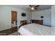 Well-lit bedroom with ensuite bathroom and a view of the bathroom at 2057 E Brooks St, Gilbert, AZ 85296