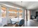 Cozy dining area with a round table and chairs, looking out to backyard at 2057 E Brooks St, Gilbert, AZ 85296