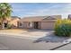 Single-story house with attached garage and desert landscaping at 2057 E Brooks St, Gilbert, AZ 85296