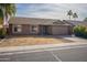 Single-story house with attached garage and desert landscaping at 2057 E Brooks St, Gilbert, AZ 85296