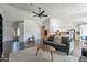 Living area with grey couches and a view of the kitchen at 2057 E Brooks St, Gilbert, AZ 85296