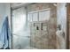 Shower with tiled walls and built-in shelves at 2057 E Brooks St, Gilbert, AZ 85296