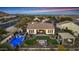 Aerial view of backyard featuring pool, fire pit, lounge area, desert landscaped backyard at 20641 W Medlock Dr, Buckeye, AZ 85396