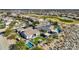 Stunning aerial view of a desert home featuring a pool, outdoor living space, and golf course views at 20641 W Medlock Dr, Buckeye, AZ 85396