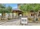 Entrance to the community bar and kitchen, with desert landscaping and a stylish sign at 20641 W Medlock Dr, Buckeye, AZ 85396