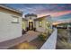 Attractive house entrance and landscaped front patio featuring desert plants and mountain view at 20641 W Medlock Dr, Buckeye, AZ 85396