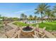 Inviting outdoor firepit with Adirondack chairs, perfect for gathering and relaxation by the pool at 20641 W Medlock Dr, Buckeye, AZ 85396