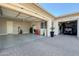 Spacious three-car garage with overhead storage, utility sink, and well-lit work area at 20641 W Medlock Dr, Buckeye, AZ 85396