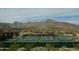 Pickleball courts featuring mountain views, shaded seating and desert landscaping at 20641 W Medlock Dr, Buckeye, AZ 85396