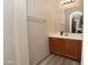 Bathroom with vanity, mirror and wood cabinets at 2150 W Alameda Rd # 1037, Phoenix, AZ 85085