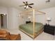 Bright bedroom with a king-size bed, ceiling fan and access to hallway at 2150 W Alameda Rd # 1037, Phoenix, AZ 85085