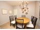 Dining area with a wood table and black chairs at 2150 W Alameda Rd # 1037, Phoenix, AZ 85085