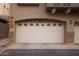 White garage door with stone accents at 2150 W Alameda Rd # 1037, Phoenix, AZ 85085