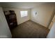 Well-lit bedroom with neutral walls and carpeting at 2168 E Sanos Dr, Tempe, AZ 85281