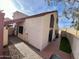 View of home's side, showing walkway and backyard access at 2168 E Sanos Dr, Tempe, AZ 85281