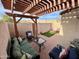 Covered patio with seating area and lush landscaping at 2168 E Sanos Dr, Tempe, AZ 85281