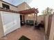 Relaxing patio with pergola, seating area, and fire pit at 2168 E Sanos Dr, Tempe, AZ 85281