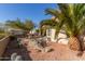 Landscaped backyard with patio and seating area at 23205 W Arrow Dr, Buckeye, AZ 85326