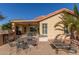 Backyard with patio, seating area, and mature palm tree at 23205 W Arrow Dr, Buckeye, AZ 85326