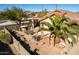 Desert landscaping with patio, built-in BBQ, and seating area at 23205 W Arrow Dr, Buckeye, AZ 85326