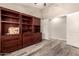 Bright bedroom with wood floors and built-in shelving at 23205 W Arrow Dr, Buckeye, AZ 85326