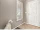 Interior entryway with white door and wood-look floors at 23205 W Arrow Dr, Buckeye, AZ 85326