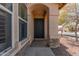 Front entry with dark door and sidelights, stone accents at 23205 W Arrow Dr, Buckeye, AZ 85326