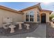 Front entry with stone accents and a decorative water feature at 23205 W Arrow Dr, Buckeye, AZ 85326