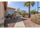 Landscaped yard with a stone walkway and seating area at 23205 W Arrow Dr, Buckeye, AZ 85326