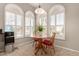 Cozy kitchen nook with a round table and three chairs at 23205 W Arrow Dr, Buckeye, AZ 85326