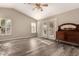 Bright living room featuring hardwood floors and french doors at 23205 W Arrow Dr, Buckeye, AZ 85326