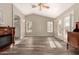 Bright living room featuring hardwood floors and french doors at 23205 W Arrow Dr, Buckeye, AZ 85326