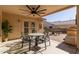 Covered patio with seating area and ceiling fan at 23205 W Arrow Dr, Buckeye, AZ 85326