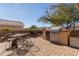 Relaxing patio area with seating and a built-in grill at 23205 W Arrow Dr, Buckeye, AZ 85326