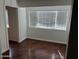 Bright bedroom with dark wood floors at 2606 W Berridge Ln # C208, Phoenix, AZ 85017