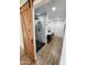 Modern bathroom with a black-framed glass shower, vanity with dark cabinetry, and a sliding barn door at 2614 E Mountain View Rd, Phoenix, AZ 85028