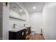 Bathroom with double vanity, gold fixtures, and hardwood floors at 2614 E Mountain View Rd, Phoenix, AZ 85028