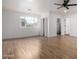 Spacious bedroom with hardwood floors and ceiling fan at 2614 E Mountain View Rd, Phoenix, AZ 85028